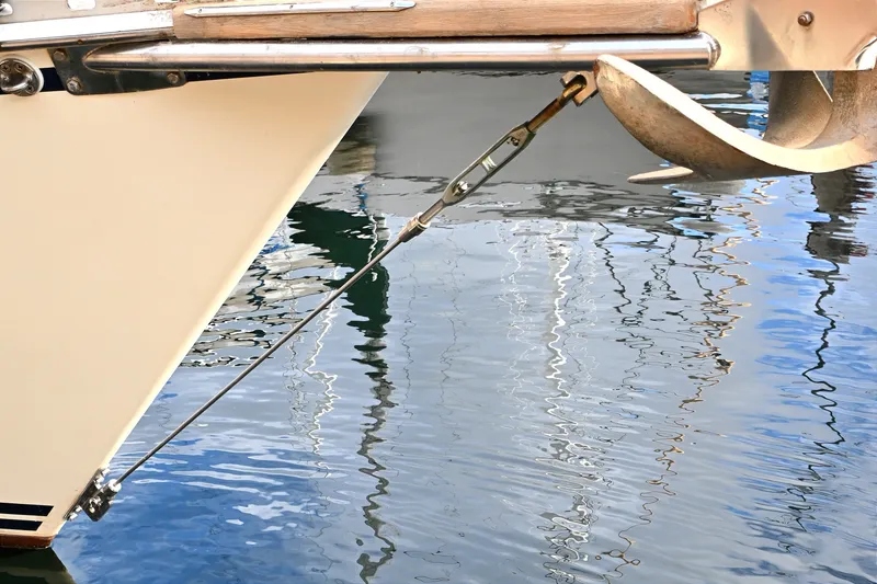 Slide: The Image of Bow of 2001 Caliber 40 LRC sailboat with anchor and water reflection. - 38