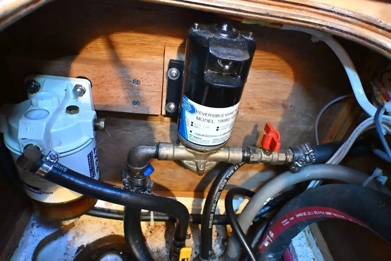 Slide: The Image of Engine compartment of 2001 Caliber 40 LRC with fuel filter and pump system. - 74