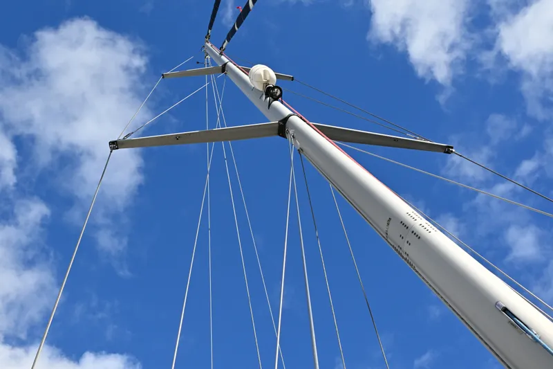 Slide: The Image of Tall mast of 2001 Caliber 40 LRC sailboat against blue sky. - 34