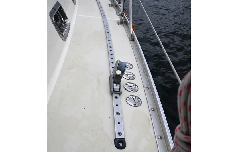 Slide: The Image of Deck of 2001 Caliber 40 LRC sailboat with fittings and ocean view. - 24