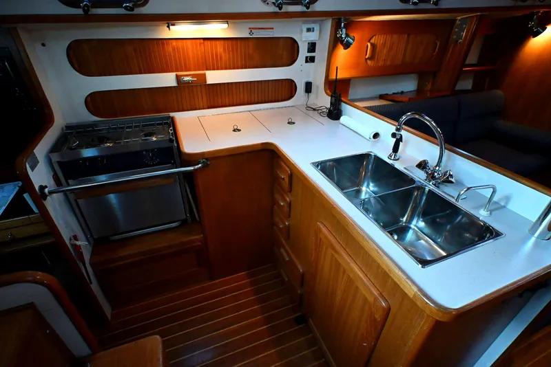 Slide: The Image of Luxurious 2001 Caliber 40 LRC yacht kitchen with dual sinks and stove. - 47
