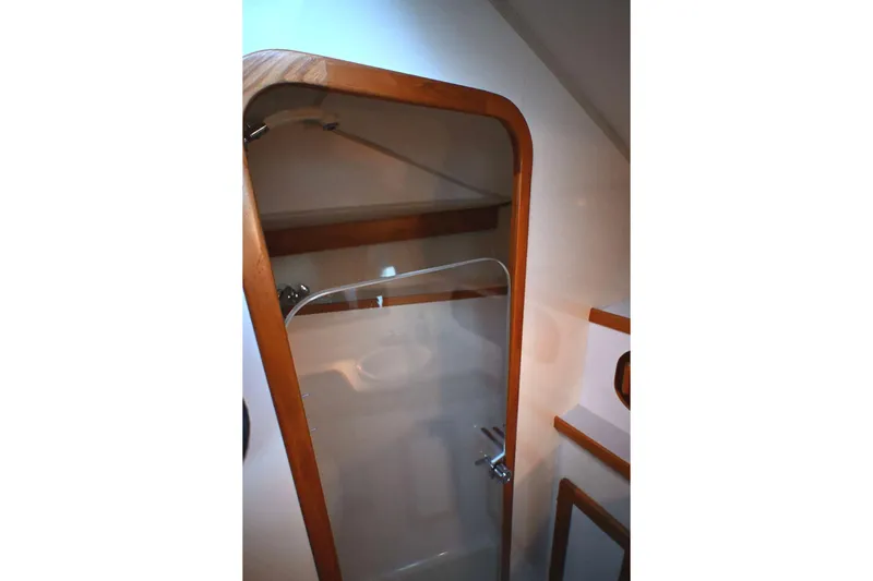 Slide: The Image of Shower area in 2001 Caliber 40 LRC yacht with wooden trim and glass door. - 61