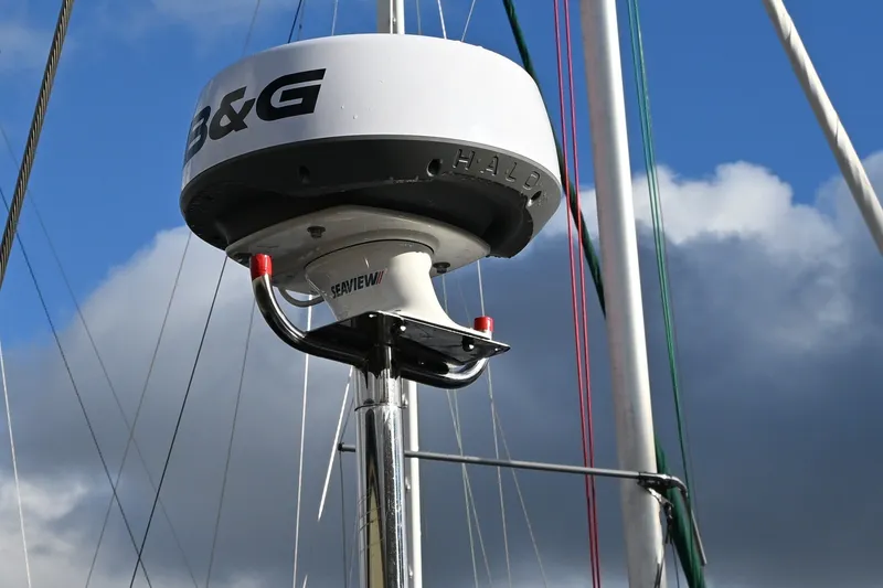Slide: The Image of Radar equipment on a 2001 Caliber 40 LRC sailboat against a cloudy sky. - 35