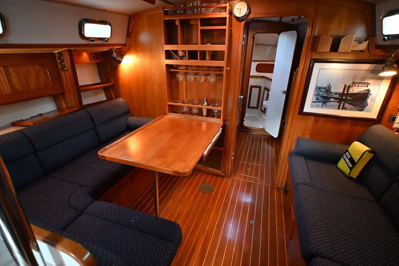 Slide: The Image of Cozy interior of 2001 Caliber 40 LRC yacht with wooden furnishings and seating area. - 45