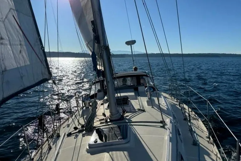 Slide: The Image of Sailing on a 2001 Caliber 40 LRC yacht, gliding through sunlit waters. - 0