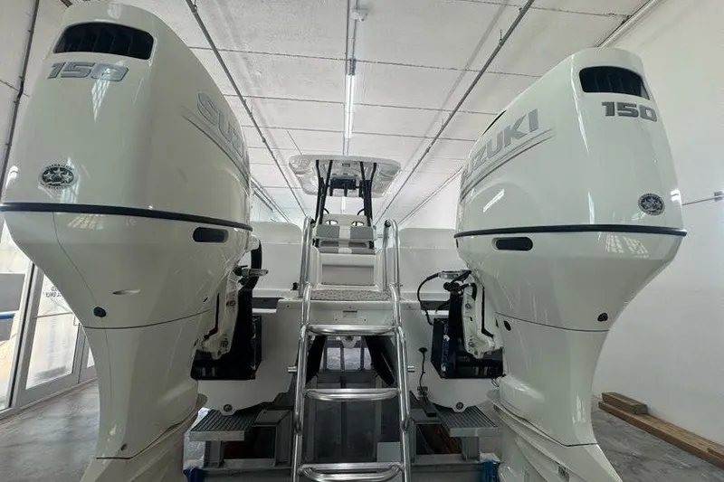 Slide: The Image of 2020 Twin Vee 260 CC SE boat with dual Suzuki 150 outboard engines. - 21