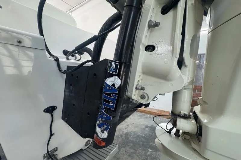 Slide: The Image of Close-up of 2020 Twin Vee 260 CC SE boat engine components. - 24