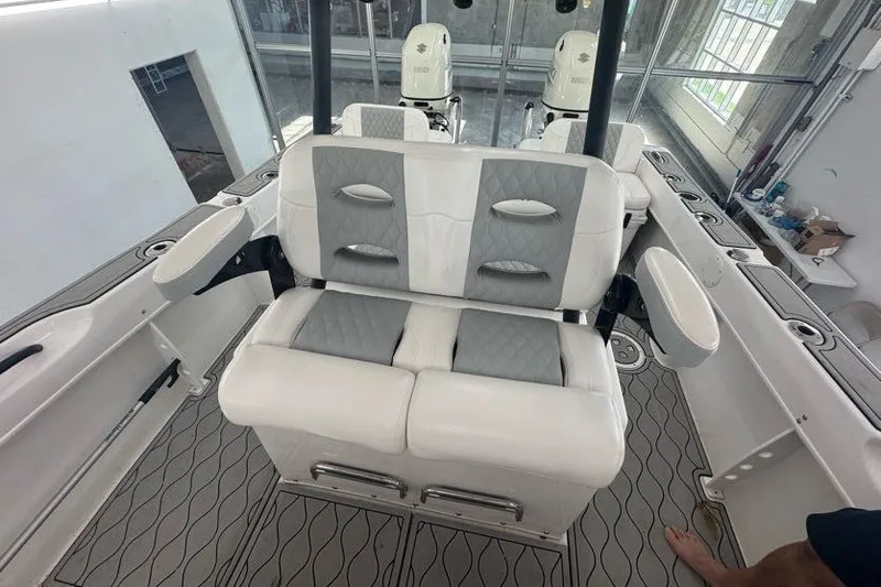 Slide: The Image of 2020 Twin Vee 260 CC SE boat interior with cushioned seating and modern design. - 43