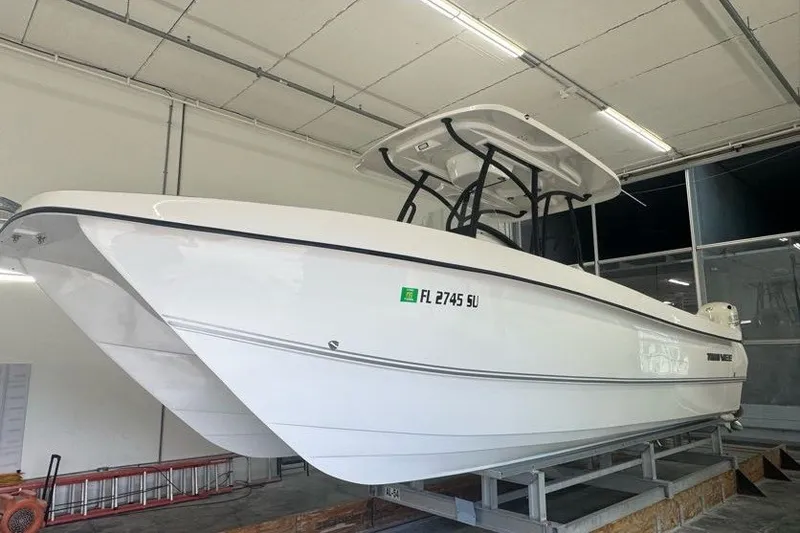 Slide: The Image of 2020 Twin Vee 260 CC SE boat in indoor storage, side view. - 14