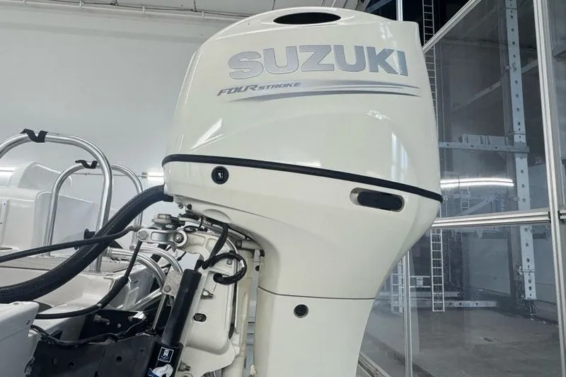 Slide: The Image of Suzuki four-stroke outboard motor on 2020 Twin Vee 260 CC SE boat. - 22