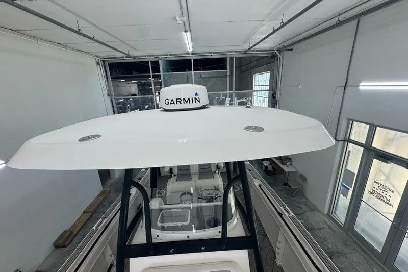 Slide: The Image of 2020 Twin Vee 260 CC SE boat with Garmin equipment in a garage. - 37