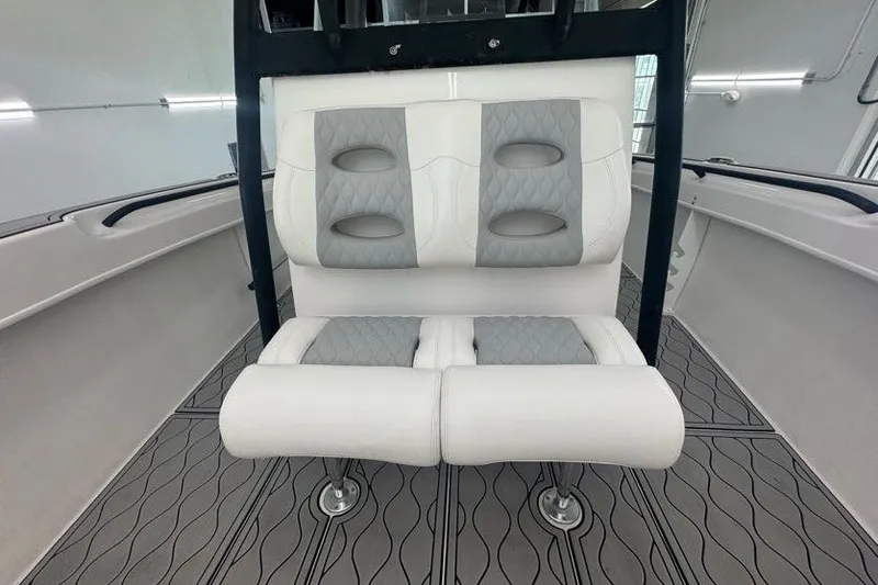 Slide: The Image of 2020 Twin Vee 260 CC SE boat interior with cushioned seating and modern design. - 46