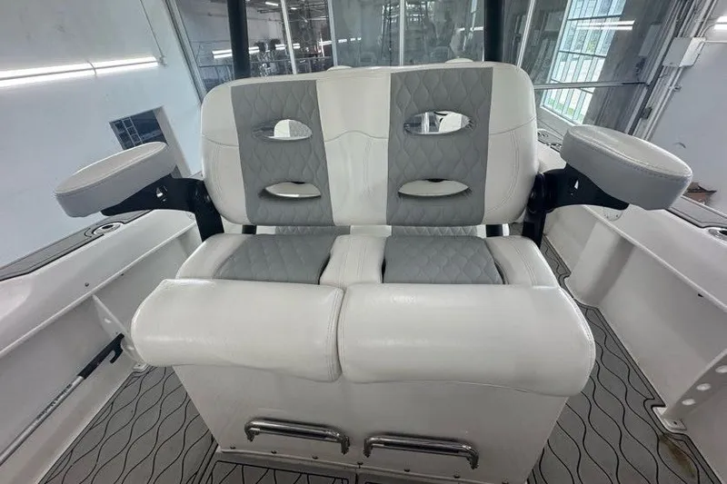 Slide: The Image of Twin Vee 260 CC SE 2020 boat seating with cushioned armrests and modern design. - 45