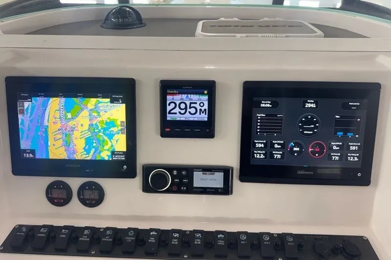 Slide: The Image of Dashboard of 2020 Twin Vee 260 CC SE with Garmin navigation displays. - 27