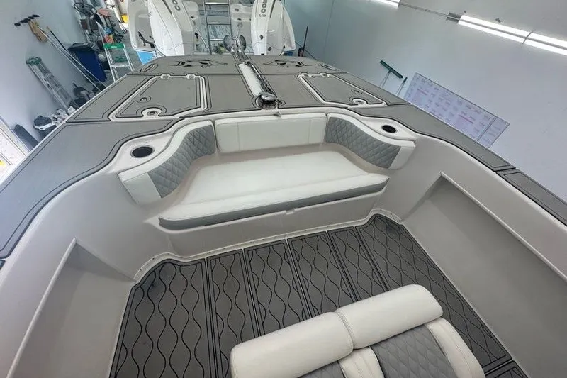 Slide: The Image of 2020 Twin Vee 260 CC SE boat interior with cushioned seating and modern design. - 49