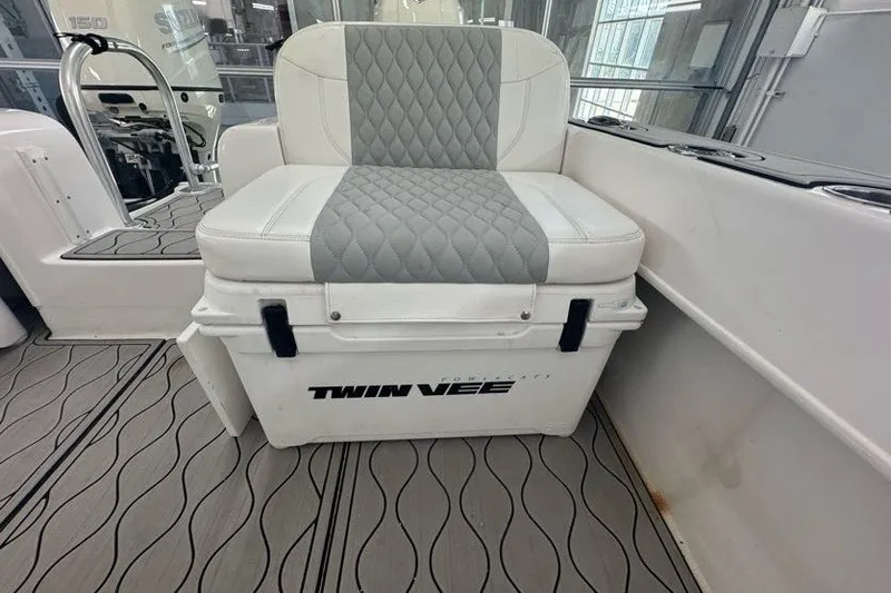 Slide: The Image of Twin Vee 260 CC SE 2020 boat seat with quilted cushion and branded cooler. - 39