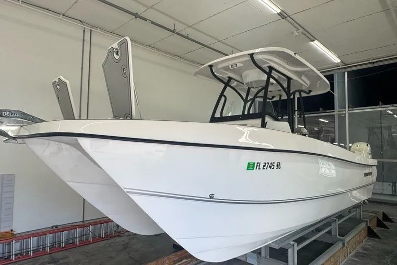Slide: The Image of 2020 Twin Vee 260 CC SE boat in showroom, side view. - 17