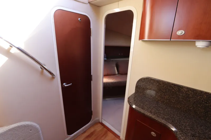 Slide: The Image of Interior of 2005 Sea Ray 390 Motor Yacht with wood cabinetry and granite countertop. - 43