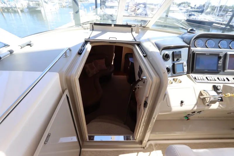 Slide: The Image of 2005 Sea Ray 390 Motor Yacht helm with cabin entrance, marina view. - 29