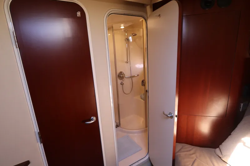 Slide: The Image of 2005 Sea Ray 390 Motor Yacht interior with shower and wooden doors. - 48