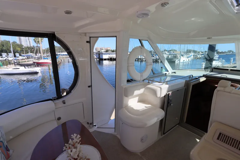 Slide: The Image of Interior view of 2005 Sea Ray 390 Motor Yacht with marina backdrop. - 21