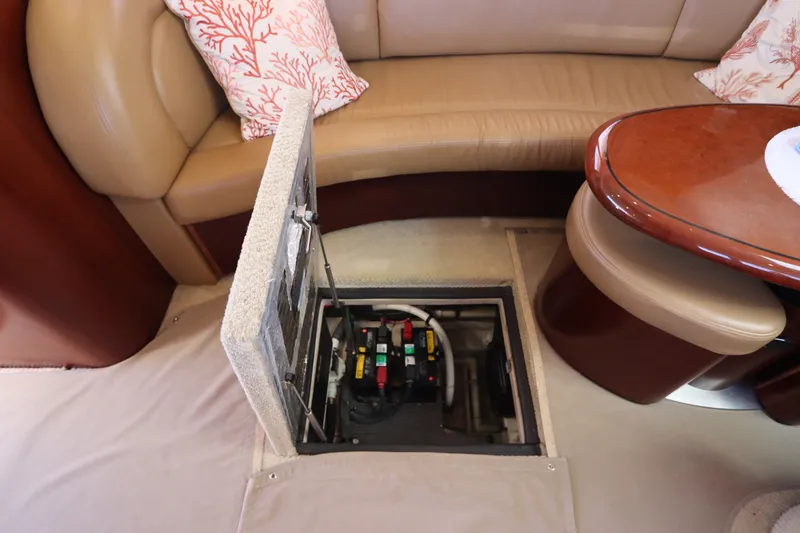 Slide: The Image of 2005 Sea Ray 390 Motor Yacht interior with open floor hatch revealing battery compartment. - 60