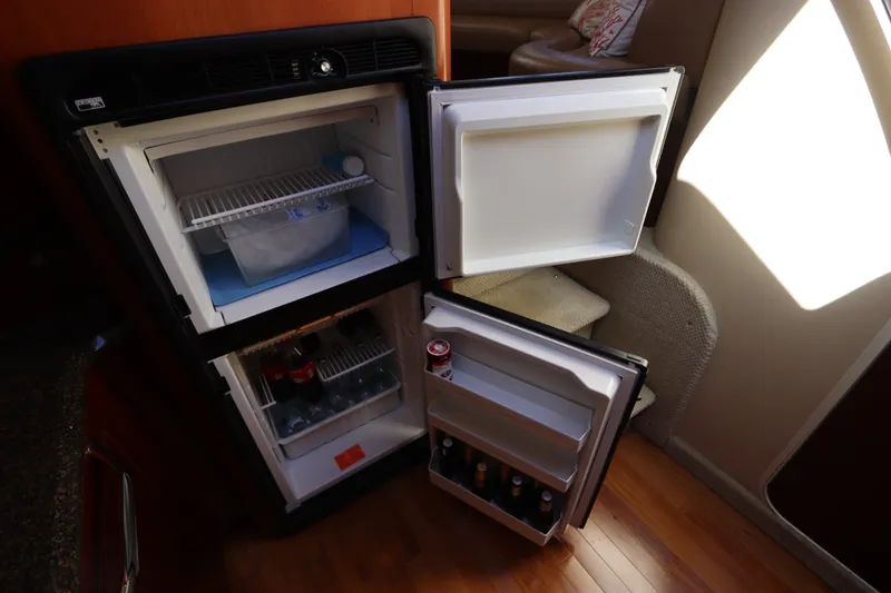 Slide: The Image of Open refrigerator in 2005 Sea Ray 390 Motor Yacht, stocked with beverages and ice. - 42