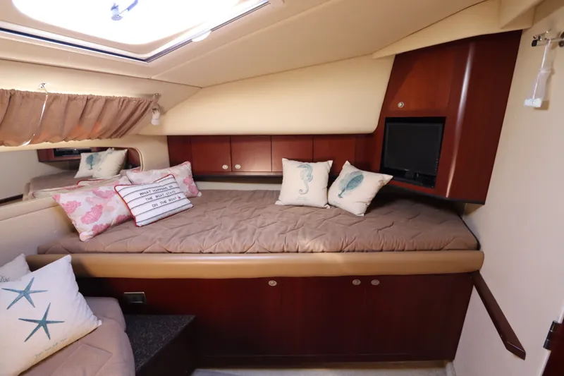 Slide: The Image of Luxurious 2005 Sea Ray 390 Motor Yacht cabin with cozy bedding and decorative pillows. - 46