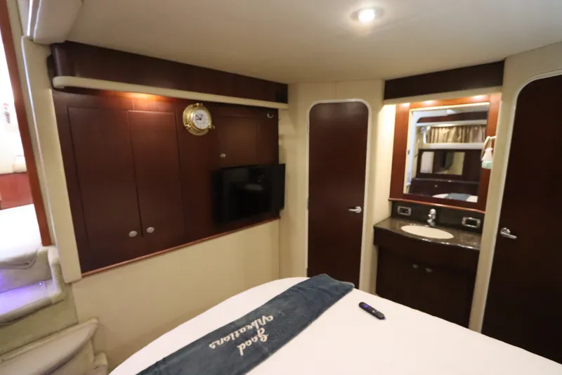 Slide: The Image of Luxurious interior of 2005 Sea Ray 390 Motor Yacht with wood cabinetry and vanity. - 54