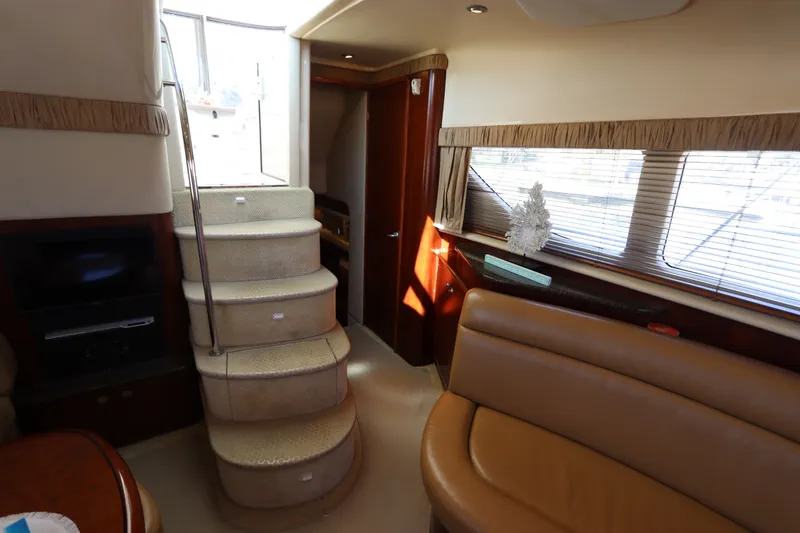 Slide: The Image of Interior of 2005 Sea Ray 390 Motor Yacht with stairs and seating area. - 51