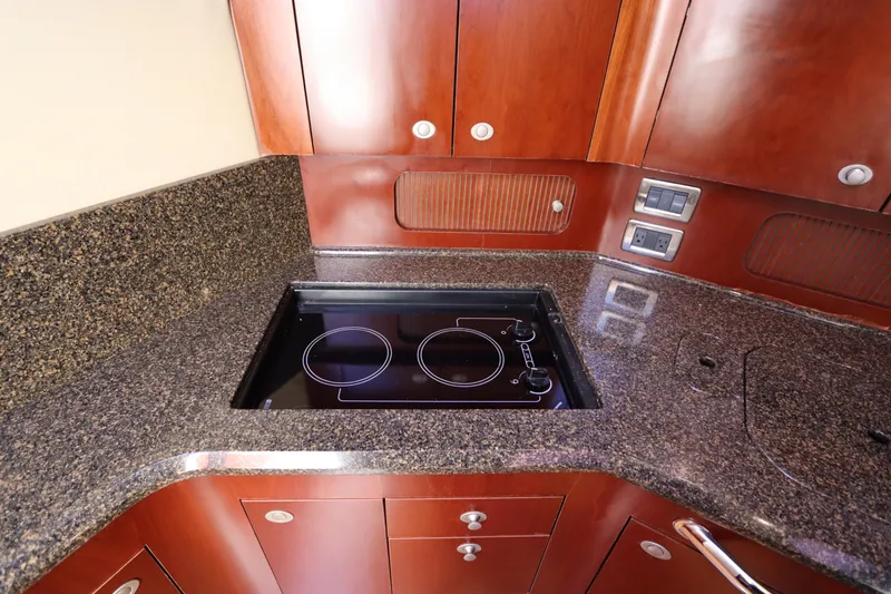 Slide: The Image of Luxurious kitchen area in 2005 Sea Ray 390 Motor Yacht with sleek countertops. - 38