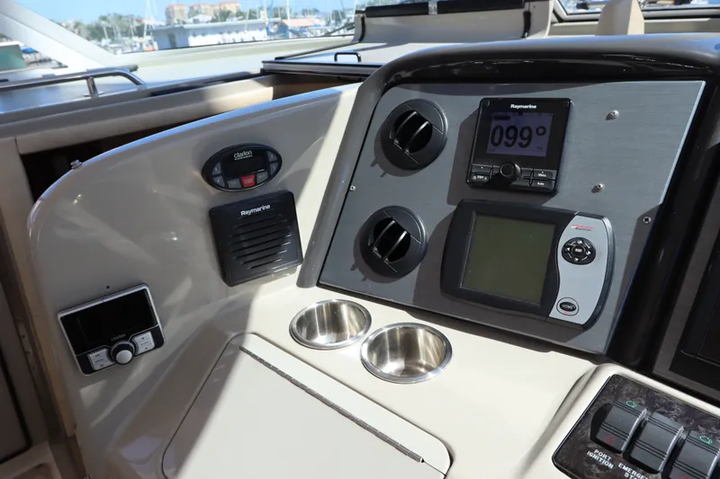 Slide: The Image of 2005 Sea Ray 390 Motor Yacht dashboard with navigation controls and cup holders. - 26