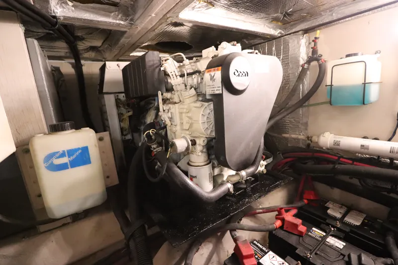 Slide: The Image of Engine room of a 2005 Sea Ray 390 Motor Yacht with visible components and wiring. - 66