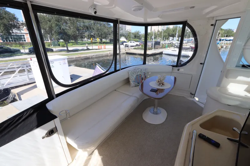 Slide: The Image of Luxurious interior of a 2005 Sea Ray 390 Motor Yacht with elegant seating and table. - 16