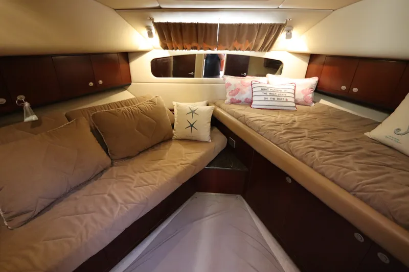Slide: The Image of Luxurious 2005 Sea Ray 390 Motor Yacht cabin with cozy bedding and decorative pillows. - 45