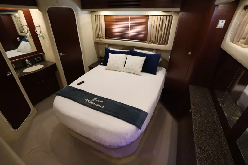 Slide: The Image of Luxurious bedroom interior of 2005 Sea Ray 390 Motor Yacht with elegant bedding. - 52