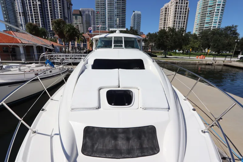 Slide: The Image of 2005 Sea Ray 390 Motor Yacht docked in urban marina with skyscrapers. - 13
