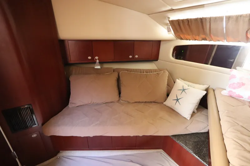 Slide: The Image of Interior cabin of 2005 Sea Ray 390 Motor Yacht with cozy seating and decorative pillows. - 47