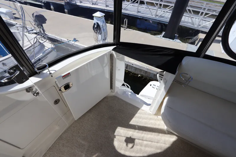 Slide: The Image of Interior view of 2005 Sea Ray 390 Motor Yacht with open door to dock. - 19