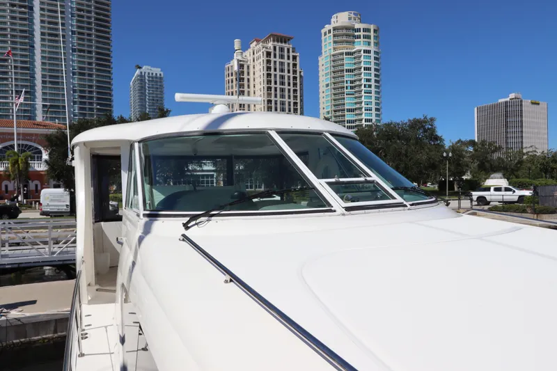 Slide: The Image of 2005 Sea Ray 390 Motor Yacht docked with city skyline in background. - 15