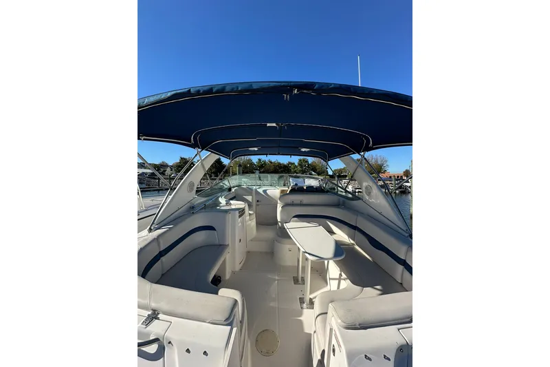 Slide: The Image of 2002 Chaparral Signature 320 boat interior with seating and canopy. - 17