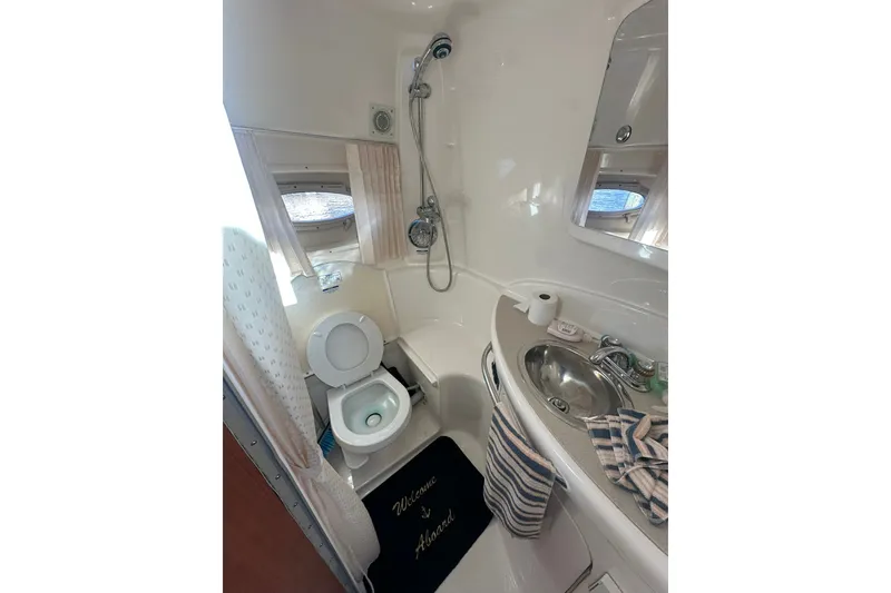 Slide: The Image of Bathroom interior of 2002 Chaparral Signature 320 boat with shower and sink. - 21