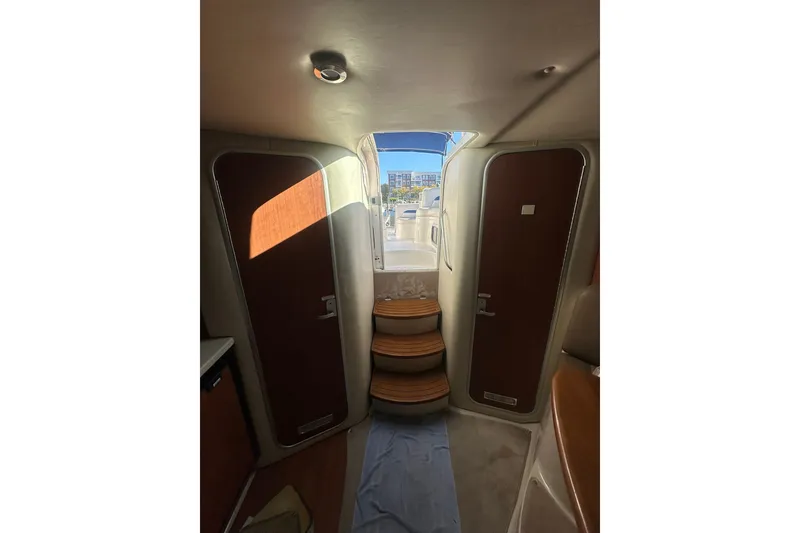 Slide: The Image of Interior view of 2002 Chaparral Signature 320 yacht with wooden steps and doors. - 20