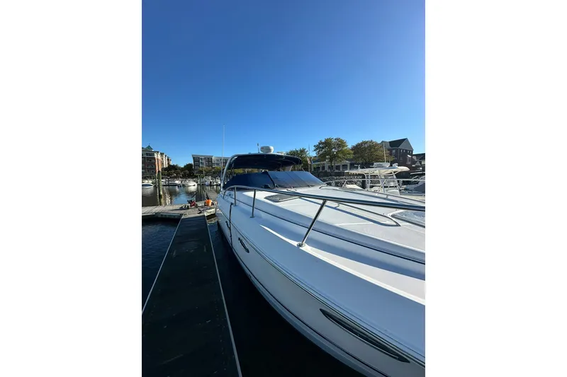 Slide: The Image of Chaparral Signature 320 yacht docked at marina, clear blue sky, 2002 model. - 7