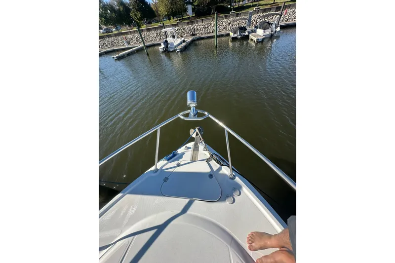 Slide: The Image of Bow view of 2002 Chaparral Signature 320 at a marina dock. - 13