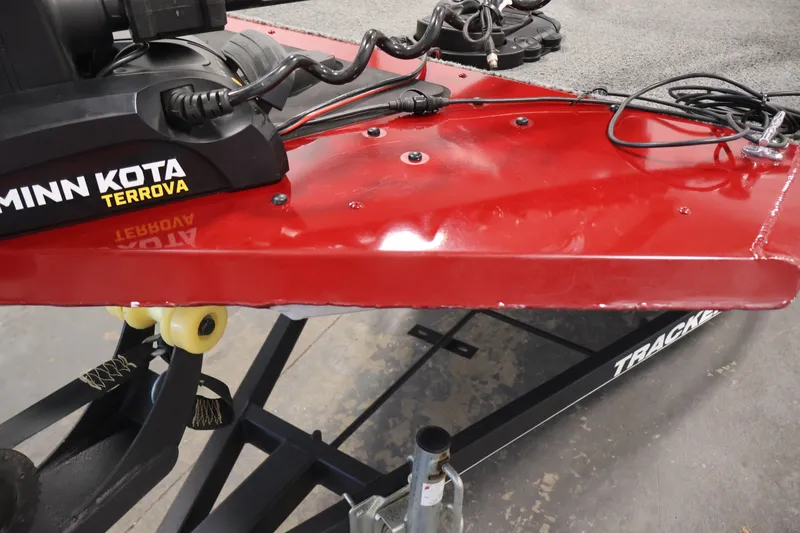 Slide: The Image of 2019 Tracker Pro 170 boat with Minn Kota Terrova motor on red deck. - 38