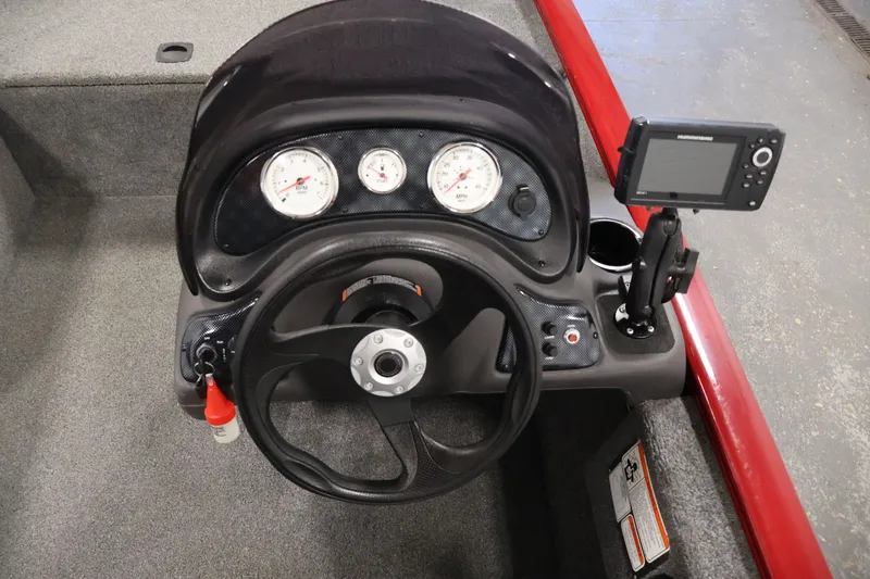 Slide: The Image of Steering console of a 2019 Tracker Pro 170 boat with gauges and a mounted device. - 20