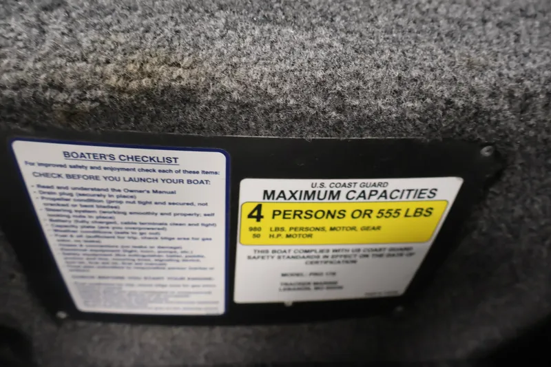 Slide: The Image of 2019 Tracker Pro 170 capacity label, showing maximum 4 persons or 555 lbs. - 26