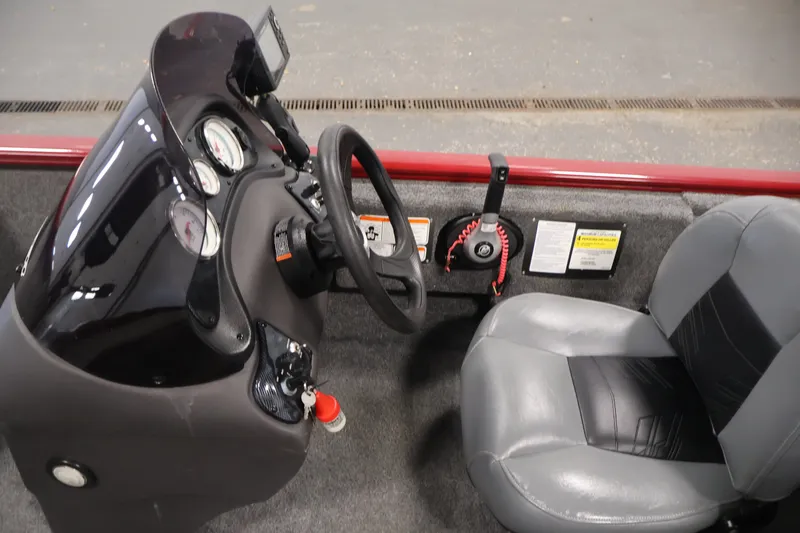 Slide: The Image of 2019 Tracker Pro 170 boat interior with steering wheel and gauges. - 19