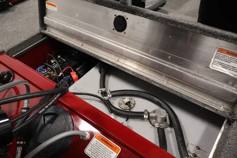 Slide: The Image of 2019 Tracker Pro 170 boat interior showing battery and wiring components. - 29